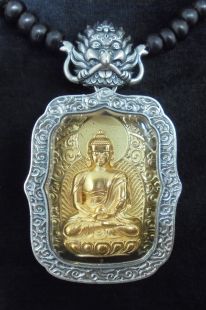 Silver frame w/brass deity